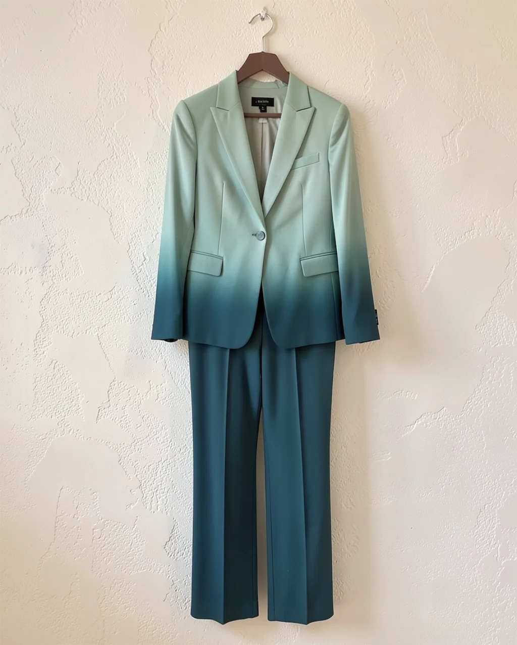 Mannequin/flat-lay photo of a designer suit before AI conversion